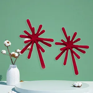 Detail view of striking red firework alloy stud earrings highlighting avant-garde texture.