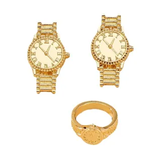 Gold color watch shaped jewelry set including earrings and ring, vintage metallic fashion accessories.