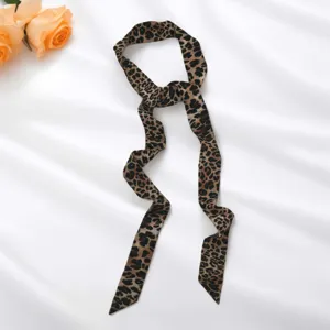 Leopard print skinny silk scarf detail view, trendy Y2K fashion choker and versatile neck band.