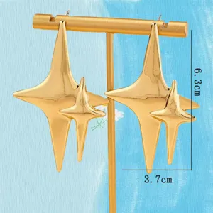 Gold geometric four-pointed star earrings detail, stylish statement jewelry for women daily wear.