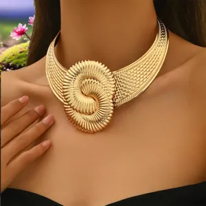 Gold statement choker necklace, exaggerated geometric twisted spiral design detail shot.