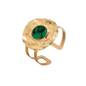 Hammered pleated open cuff bracelet with a central green stone for stylish party wear.