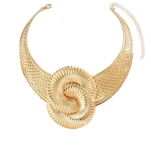 Gold statement collar necklace with textured wave pattern and central spiral knot.