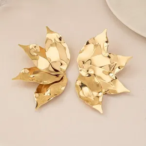 Exaggerated gold leaf stud earrings, fashion vintage street style statement jewelry for women.