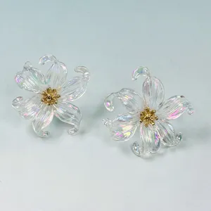 Transparent iridescent acrylic flower earrings with gold center for women, stylish trendy design.