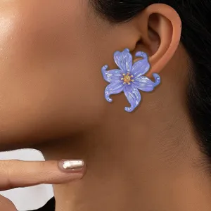 Close-up detail shot of translucent purple flower acrylic earrings, elegant petal design.