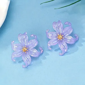 Detailed view of translucent acrylic colorful petal earrings showcasing exquisite flower design.