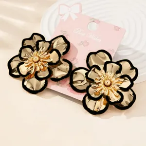 Exquisite metallic flower earrings with elegant black edges, chic detail design for daily wear.