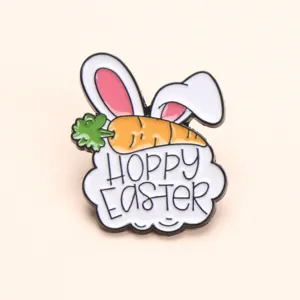 Close-up detail shot of cute Easter bunny ears and carrot metal enamel brooch accessory.