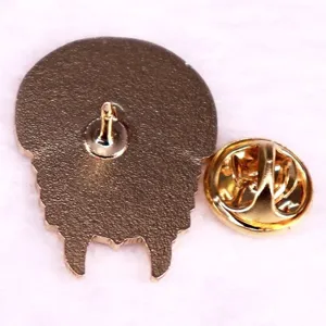 Detailed close-up of metal trilobite fossil brooch pin back, archaeology badge accessory.