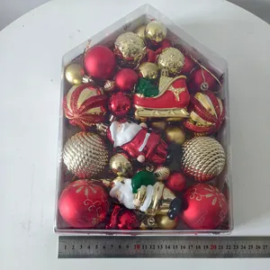 Close up detail of 72 pieces Christmas baubles set in house shaped box with assorted ornaments.
