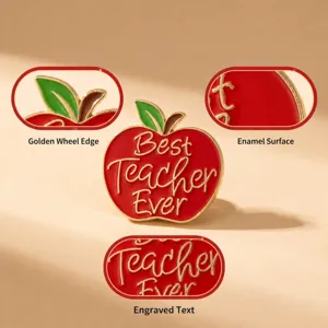 Teacher apple enamel brooch detail showing golden outline, red enamel surface, and fine engraving.
