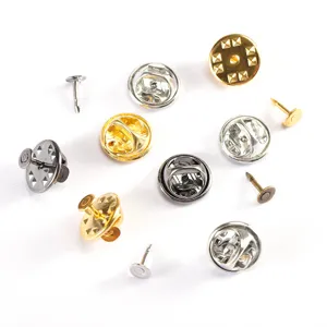 Close up shot of assorted metal butterfly clutch pin backs and tacks for DIY badge accessories.