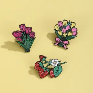 Spring floral enamel brooch set featuring cute pink tulips and strawberry branch designs for bags.