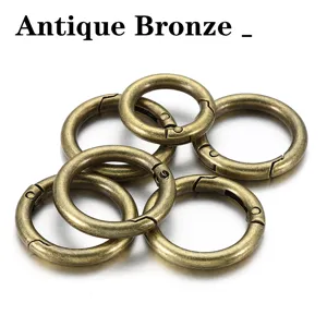 Close up detail shot of antique bronze metal alloy spring rings for handmade DIY crafts.