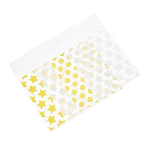 Sachets en plastique transparents adhésifs avec étoiles dorées pour emballage bijoux.