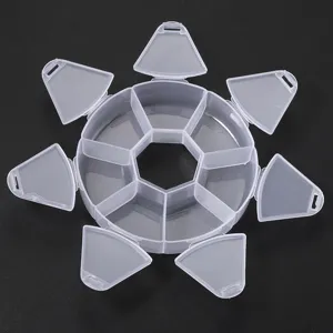 Detail view of transparent plastic storage box with multi-grid compartments for small items.
