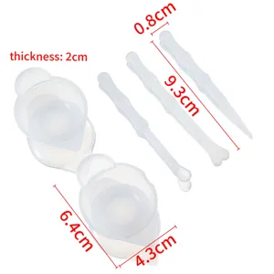 Silicone measuring cups and mixing tools set for DIY epoxy resin crafting and art projects.