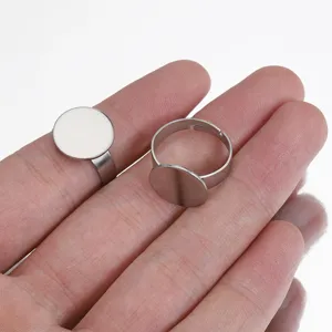 Close-up detail of stainless steel DIY blank flat pad ring base for custom jewelry making.