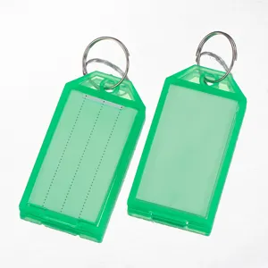 Plastic key tags with split rings and write-on labels for luggage sorting detail shot.