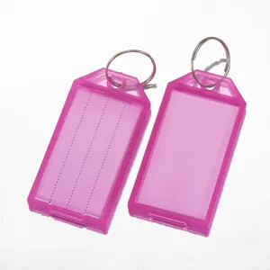 Pink plastic key tags with split rings and blank insert cards for luggage and keys identification.