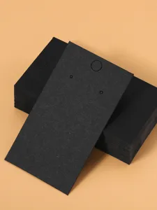 Detail shot of black paper jewelry display cards, perfect for necklace and bracelet packaging.