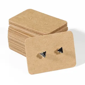 Black triangular stud earrings set with kraft paper display cards for jewelry packaging retail display.