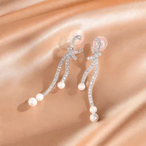 Elegante strik lange oorknopjes met sprankelende strass-steentjes en parels voor dames chic.