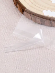 Transparent self adhesive OPP bag detail view showing clear sealing tape and packaging quality.
