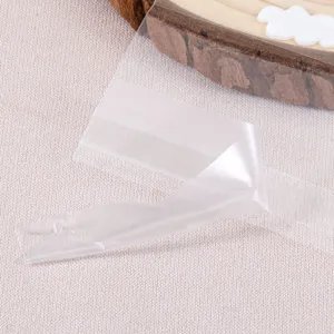 Transparent self-adhesive OPP bag sealing strip clear plastic packaging accessory.