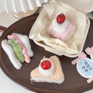 Plush food keychains detail view, featuring cute sandwich and cake plushie charms for bags.
