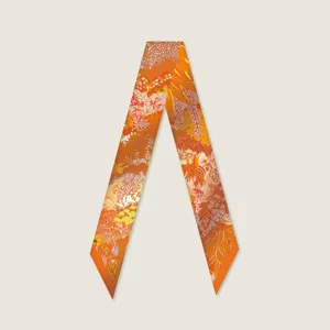 Orange botanical print twilly silk scarf for handbag handle ribbon and stylish neck accessory.