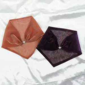 Detailed view of colorful pleated triangle scarf featuring a sparkling rhinestone magnetic buckle.