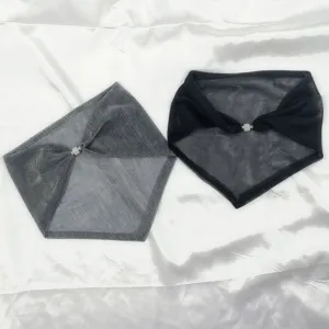 Close-up detail of sheer mesh triangular neck scarf with sparkling magnetic buckle.