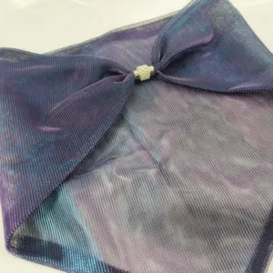 Close-up of sparkling neck scarf featuring a rhinestone magnetic buckle and mesh fabric texture.