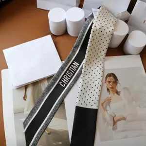 Black white polka dot skinny silk twilly scarf for handbag handle and hair styling accessory.
