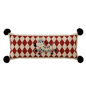 Red and white diamond pattern long bolster pillow detail with cute zebra and corner pom poms