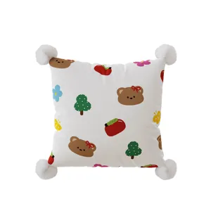 Detailed view of cute Korean style cartoon dopamine square pillowcase with fluffy pom-poms.