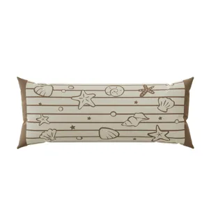 Long bolster pillow detail showing marine seashell and starfish patterns on beige stripe fabric.