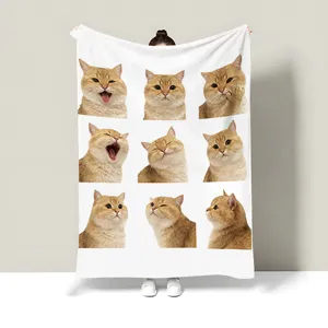 Detail view of cute cat printed flannel blanket showing funny expression pattern and soft texture.