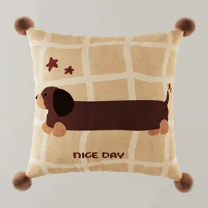 Close-up detail of a cute dachshund printed square cushion with fluffy corner pom-poms.