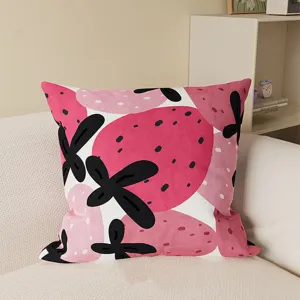 Close-up detail of the pink abstract strawberry print square throw pillow for sofa.