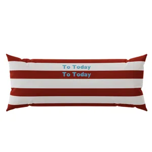 Detail shot of a modern striped long bolster pillow with red and white colors and text.