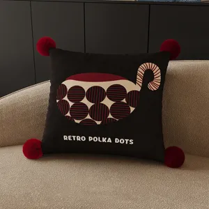 Retro polka dot throw pillow detail view, modern square sofa cushion with cozy pom-poms.