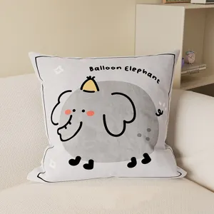 Detail view of the cute cartoon elephant cushion on sofa, soft fabric pillowcase for home.