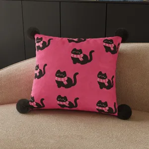 Detail view of the pink square cushion featuring cute black cats with pink scarves.