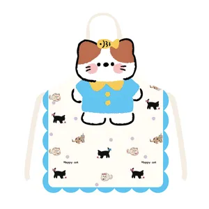 Close-up detail of the cute cartoon cat apron featuring scalloped blue border and sweet print.