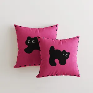 Close-up detail of pink dopamine style cat print decorative throw pillows with black accents