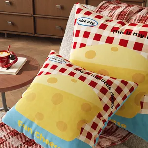 Detailed view of cute cheese and red grid plush throw pillow, cozy home sofa decor.