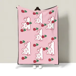 Cute pink blanket with bear and tulip pattern, perfect detail view for office nap and room.